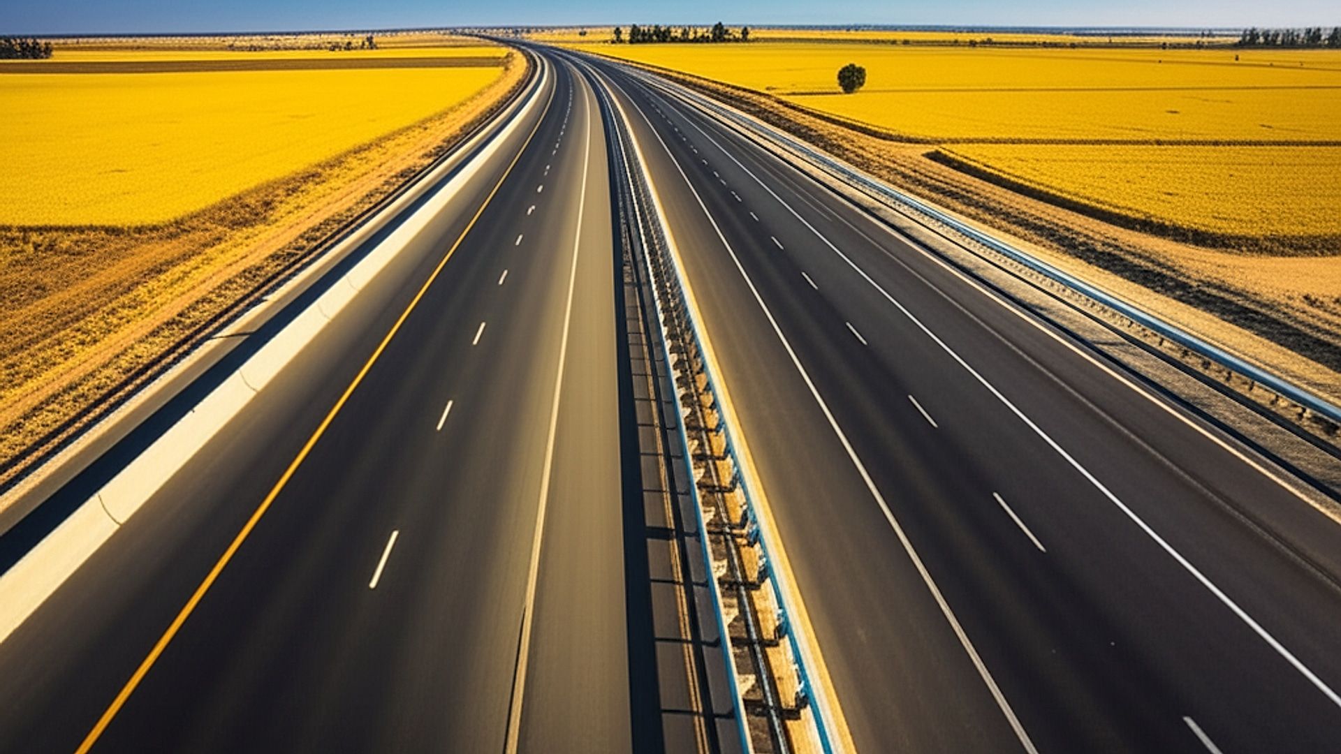High-resolution architectural photograph of the NH-754A Amritsar-Jamnagar Economic Corridor (6-lane) in Punjab. Focus on a sweeping section of the expressway, showcasing its smooth asphalt, lane markings, and sturdy concrete barriers. Capture the landscape with golden wheat fields bordering the highway. Time of day: Golden hour, late afternoon. Warm, diffused sunlight highlighting the textures of the road surface and casting long shadows across the fields. Professional architectural photography style: wide-angle lens, sharp focus throughout, minimal distortion, emphasizing scale and clean lines. Clear blue sky in the background.. Professional architectural photography, ultra-high quality, sharp focus, vivid colors, dramatic lighting, golden hour, cinematic composition, 8K UHD, photorealistic.